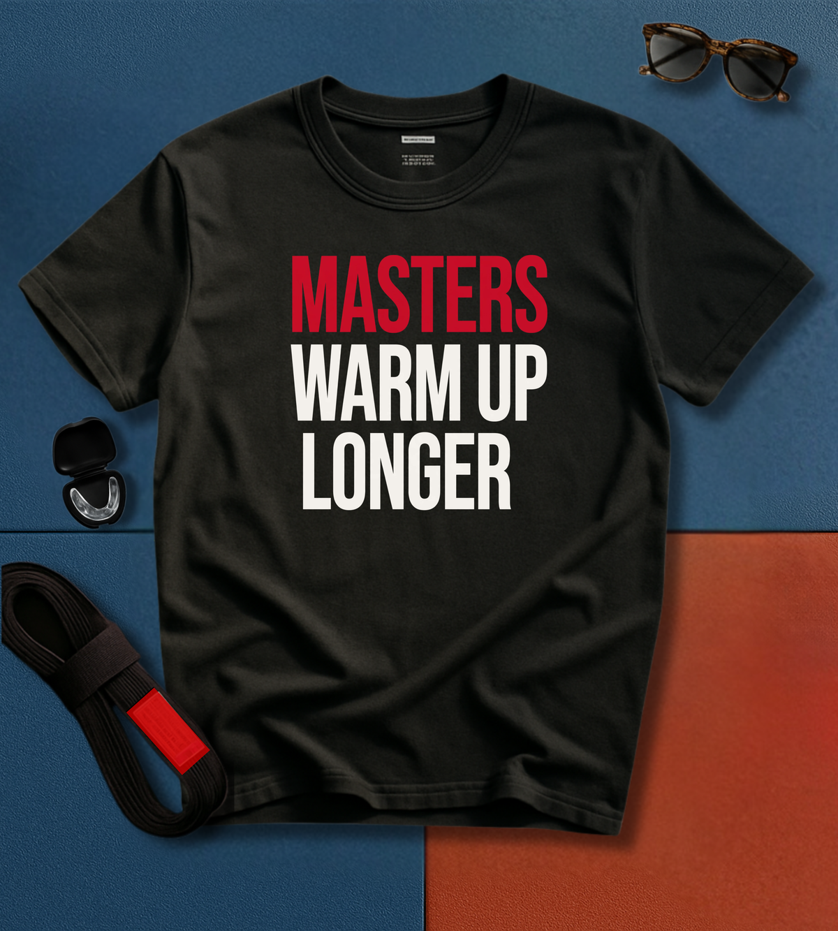 Masters Warm Up BJJ T-shirt with stacked bold print reading MASTERS WARM UP LONGER, MASTERS in red and WARM UP LONGER in off-white.